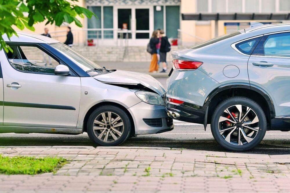 Two cars parked, one potentially involved in a rear